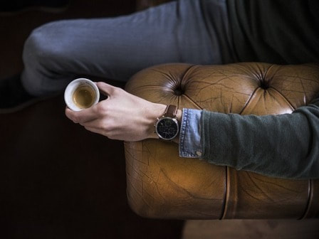 Chesterfield sofa with coffee mug
